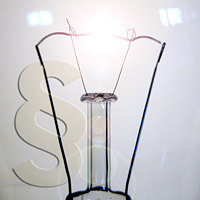 Filament lamp in front of paragraph symbol